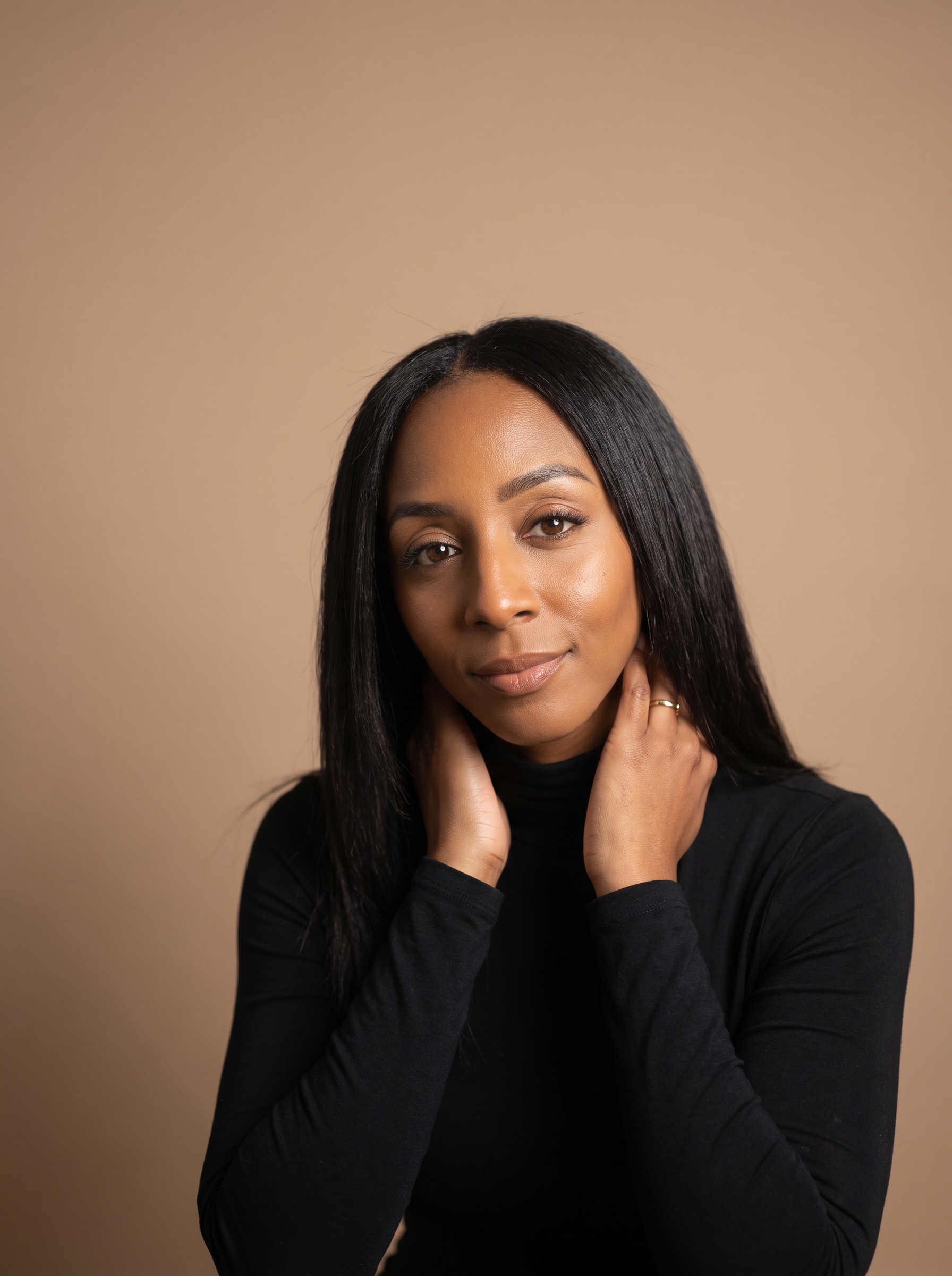 Portrait of Markesha Kirkman, seated, calm and direct expression.